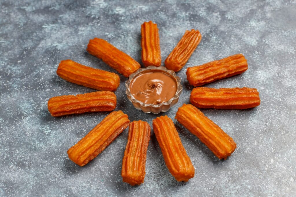 Traditional Mexican Dessert Churros With Chocolate Top View 1 1024x683