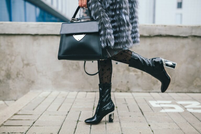 Close Up Accessories Details Stylish Woman Walking City Warm Fur Coat Winter Season Cold Weather Holding Leather Handbag Legs Boots Footwear Street Fashion Trend 1 768x512