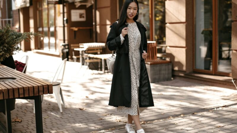 Fulllength Portrait Brunette Asian Woman Midi White Dress Black Trench Coat Stands Outside Near Street Cafe 1 800x450
